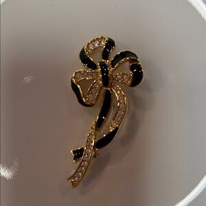 Elegant Black and Gold Bow Brooch